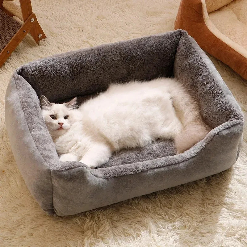 A fluffy cat lounging in a cozy warm winter pet bed, designed for comfort during cold weather.
